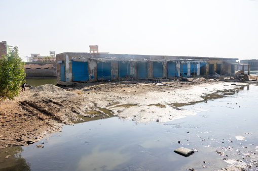 Temporary toilets and water taps in Kumbh Mela tent city, part of the 120.000 installed for the festival. Photo taken during Kumbh Mela 2019 in Prayagraj (Allahabad), India. \nKumbh Mela or Kumbha Mela is a major pilgrimage and festival in Hinduism, and probably the greatest religious festival in the World. It is celebrated in a cycle of approximately 12 years at four river-bank pilgrimage sites: the Allahabad (Ganges-Yamuna Sarasvati rivers confluence), Haridwar (Ganges), Nashik (Godavari), and Ujjain (Shipra). The festival is marked by a ritual dip in the waters, but it is also a celebration of community commerce with numerous fairs, education, religious discourses by saints, mass feedings of monks or the poor, and entertainment spectacles. Pilgrims believe that bathing in these rivers is a means to cleanse them of their sins and favour a better next incarnation.