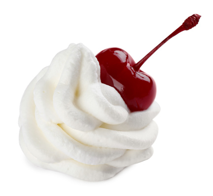 Delicious fresh whipped cream with cherry isolated on white