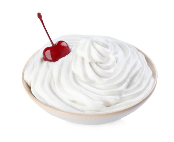 istock Delicious fresh whipped cream and cherry isolated on white 1452668250