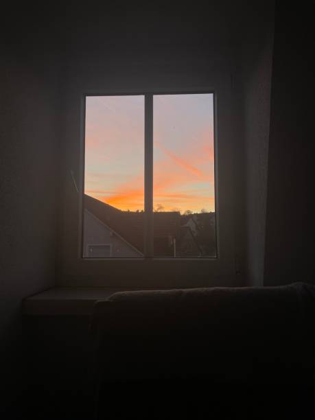 istock Beautiful view of sunset through a window 1452668437