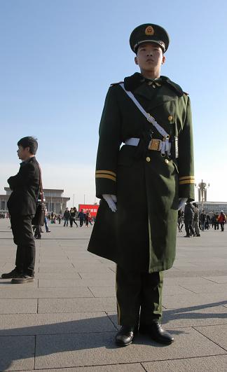 Chinese guard in Tiananmen Square, Beijing, China. Tiananmen Square is a famous landmark in Beijing
