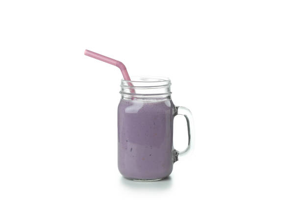 istock Fresh blueberry smoothie isolated on white background 1452669704