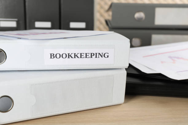 istock Folders and documents on desk in office, closeup. Bookkeeper's workplace 1452674813