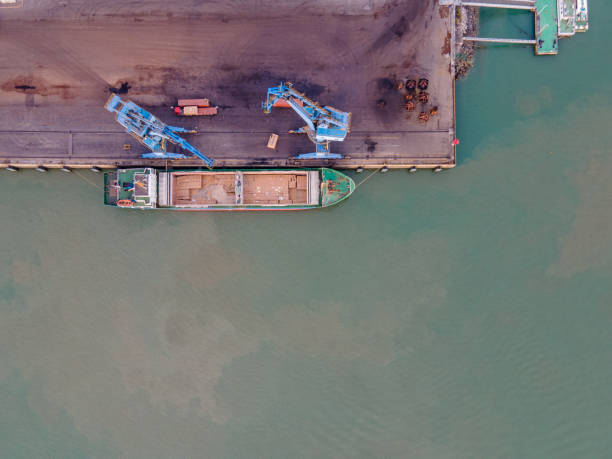 istock Vertical aerial view of the ship at the timber port unloading 1452677967