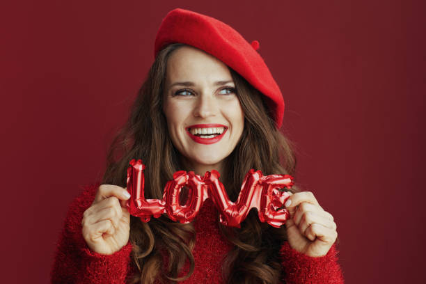 smiling stylish female with long wavy hair and love inscription - nostalgia joy laughing wellbeing imagens e fotografias de stock