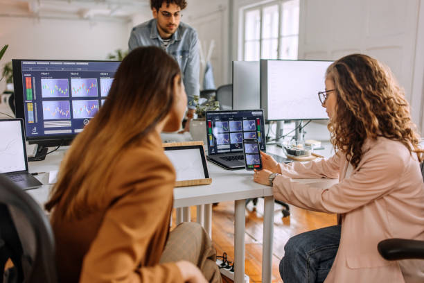 istock Colleagues analysing  cryptocurrency at the office 1452684296