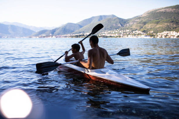 istock Boys paddling a kayak 1452684508