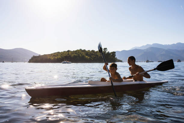istock Boys enjoying themselves while paddling a kayak 1452684552