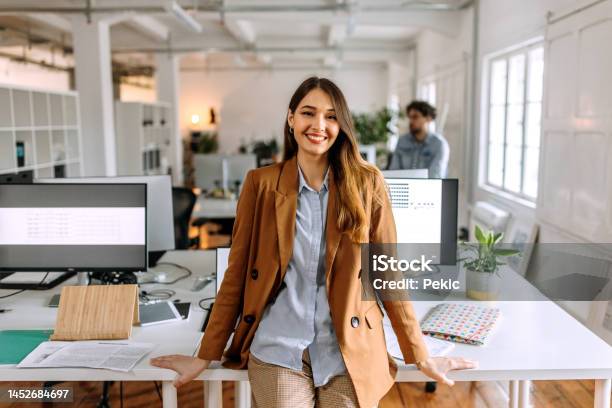 Portrait Of Young Beautiful Casually Clothed Woman In The Modern Office Stock Photo - Download Image Now