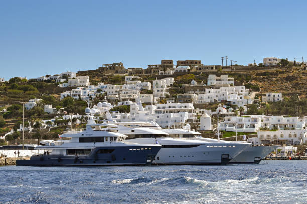 luxury yachts docked in the harbour in mykonos - yacht luxury front view ships bow imagens e fotografias de stock