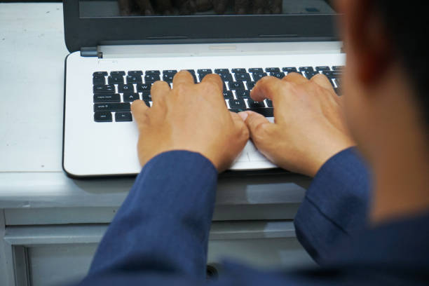 istock Asian business man hands working in office with laptop computer 1452685704