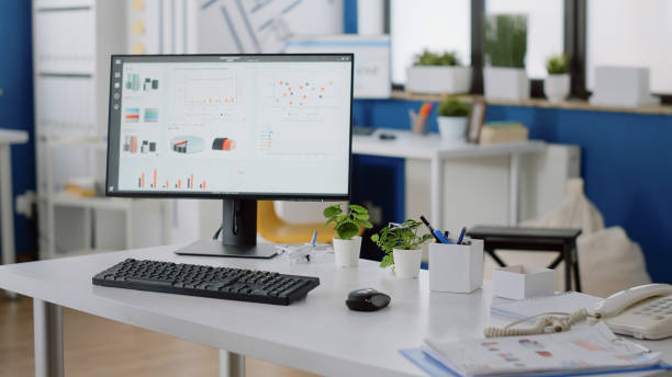 istock Nobody at desk in company office with computer and tools 1452685943