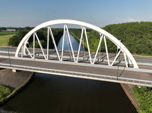 istock Bird's-eye view of an arch bridge over a river 1452687592