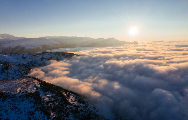 istock Caucasian mountains above the clouds at the sunset. Cloudscape, aerial view 1452690197