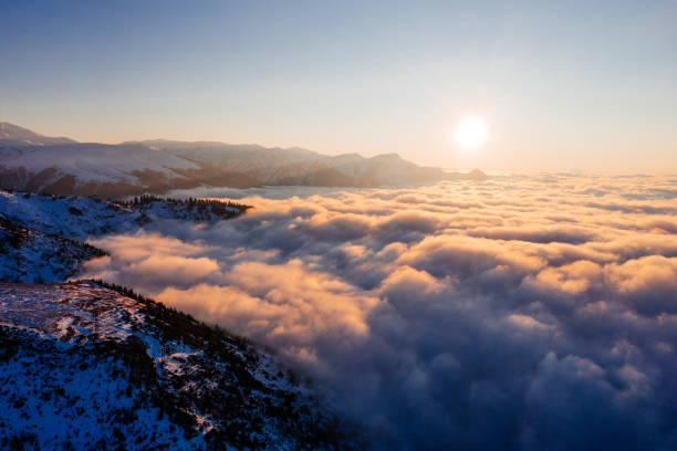 istock Caucasian mountains above the clouds at the sunset. Cloudscape, aerial view 1452690247