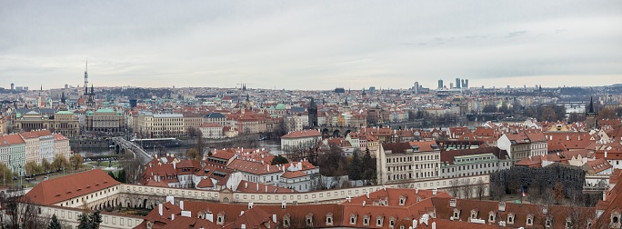 A panoramic view of the cityscape of Prague, Czech Republic, on a cloudy winter day, with a beautiful architecture