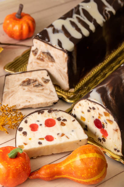 istock Artisan nougat with cherries and chocolate on autumn decorations 1452692983