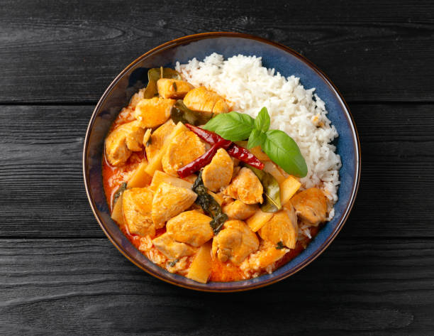 Thai red curry with chicken, vegetables and rice.