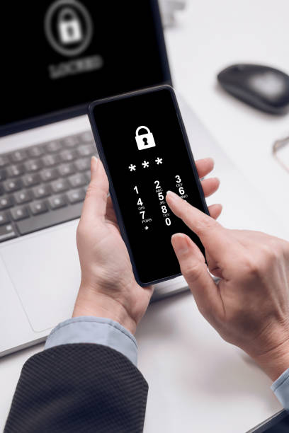 istock business woman enter pin code on phone. Information security concept. 1452693230
