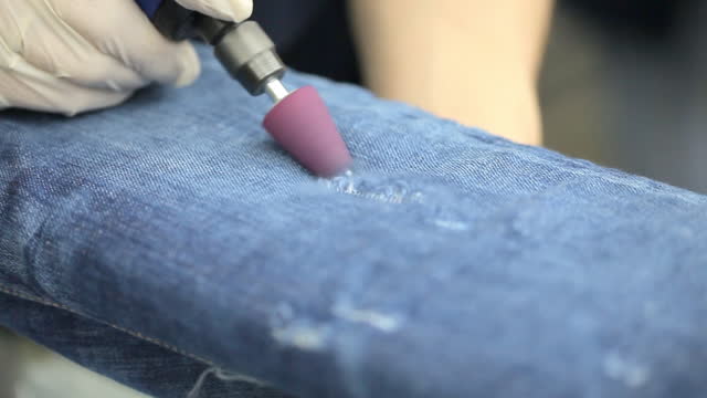 Mass production ripping jeans manufacturing