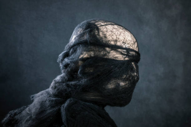 istock Creepy figure on dark misty background 1452697769