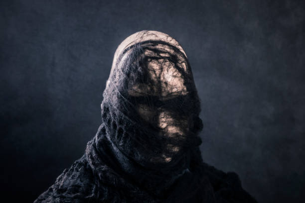 istock Creepy figure on dark misty background 1452697774