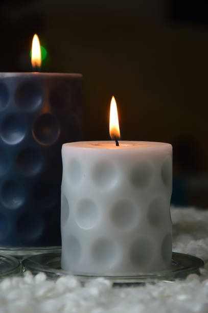 istock burning candles in the dark. background for the design. bright lights. 1452700646