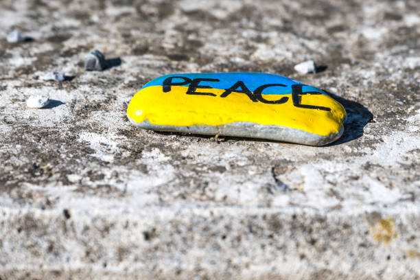 istock peace written on stone in Ukrainian colors 1452703288