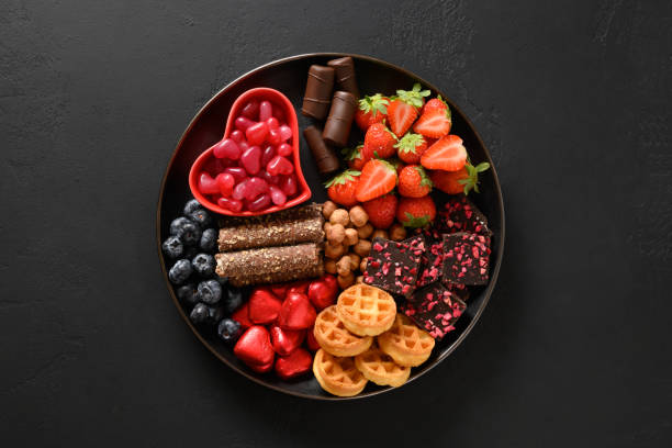 istock Charcuterie Valentines Day board with chocolate sweets. 1452703340