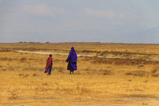 Ngorongoro Conservation Area, Tanzania - September 10, 2021: African woman with her child from Maasai tribe in Ngorongoro Conservation Area, Tanzania