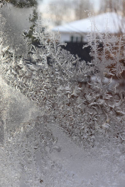 istock photo of frosty pattern on the window 1452713456