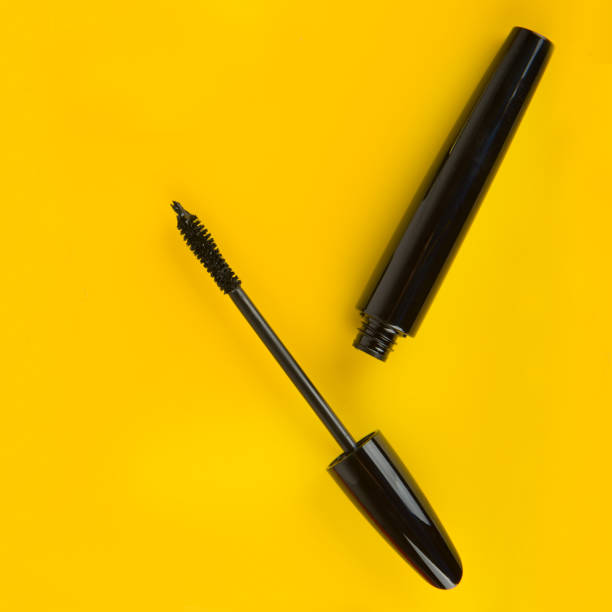 istock Mascara on a yellow background. Free space for text. 1452713992