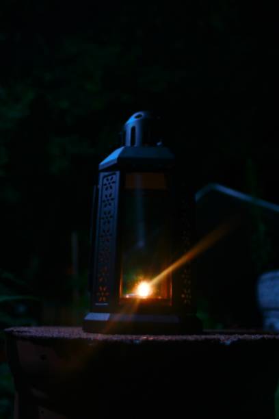 istock Vertical closeup of a lantern with bright light. 1452717084