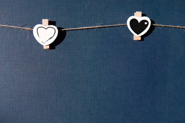 two hearts clothespins on a blackboard with copy space. Valentine's Day