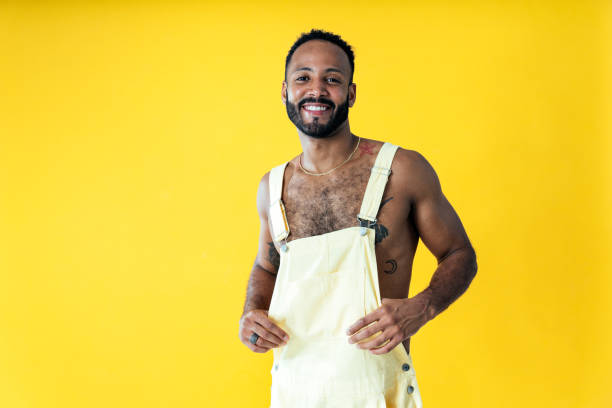 istock Man posing on colored backgrounds in studio wearing trendy clothes 1452720516