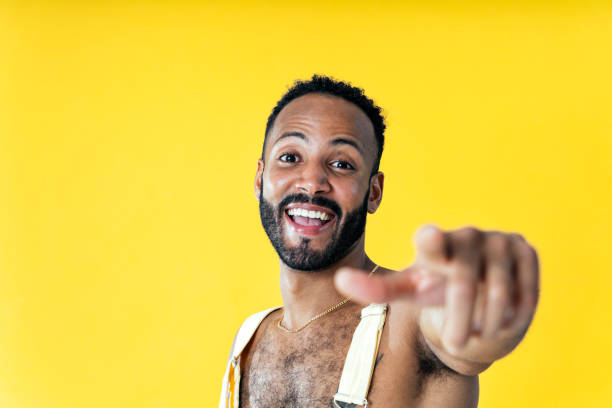istock Man posing on colored backgrounds in studio wearing trendy clothes 1452720579