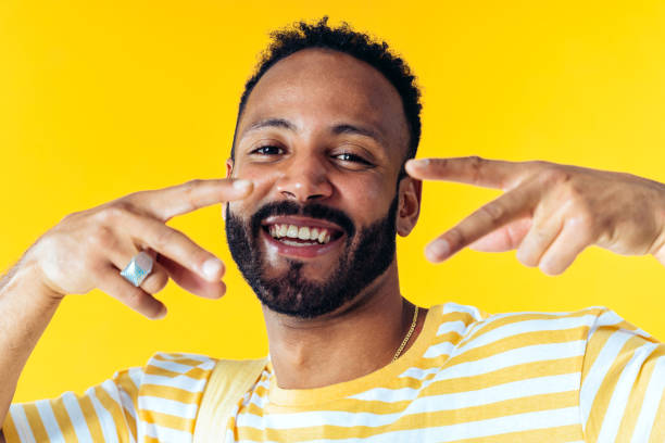 istock Man posing on colored backgrounds in studio wearing trendy clothes 1452722033