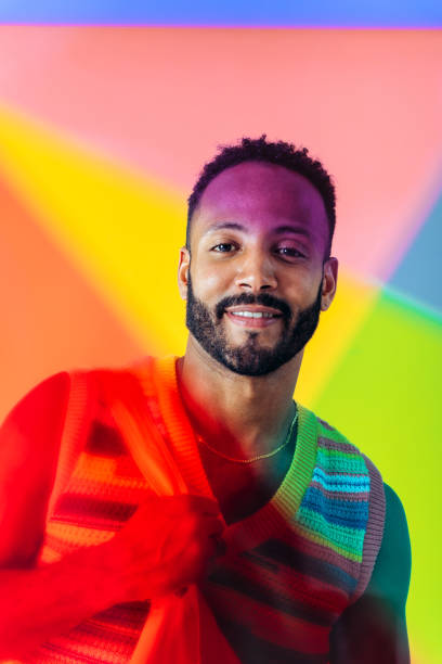 istock Man posing on colored backgrounds in studio wearing trendy clothes 1452722243