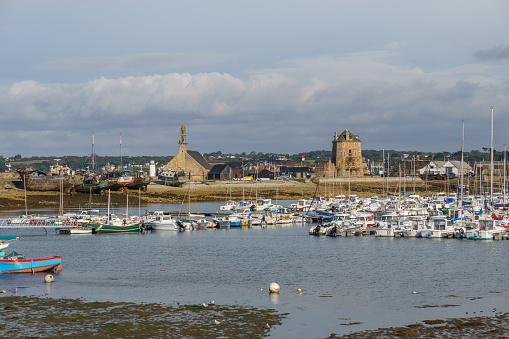 Port of Camaret-sur-Mer with sailing boats on the water surface and church and tower, Crozon peninsula, Finistere, Brittany, France