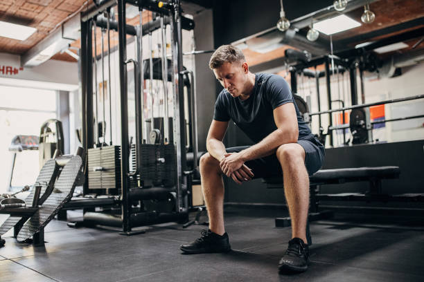 istock Man sitting in gym 1452724026