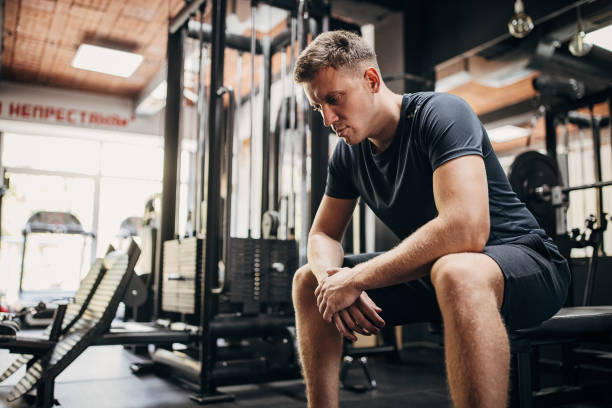 istock Man sitting in gym 1452724053