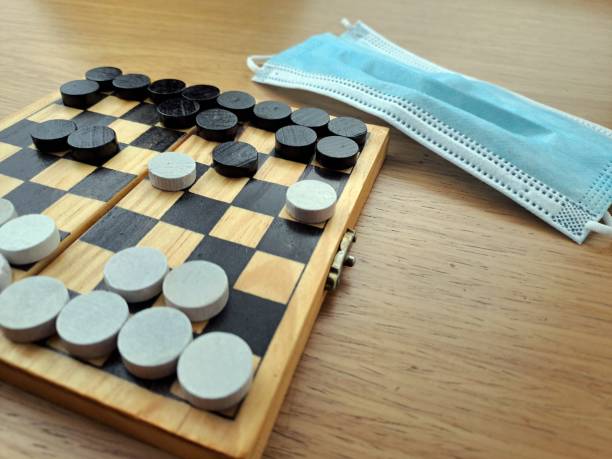 istock Checkerboard with checkers - Business strategy planning 1452724192