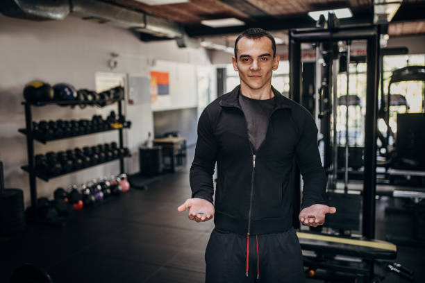 istock Man holding supplement pills 1452727199