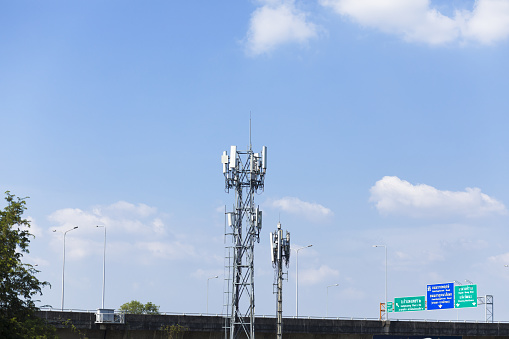 Tall mast with internet repeaters at elevated expressway in Bangkok