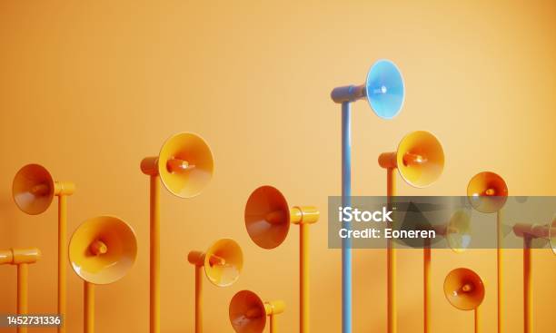 Blue Colored Megaphone Standing Out From The Crowd Stock Photo - Download Image Now - Marketing, Communication, Concepts