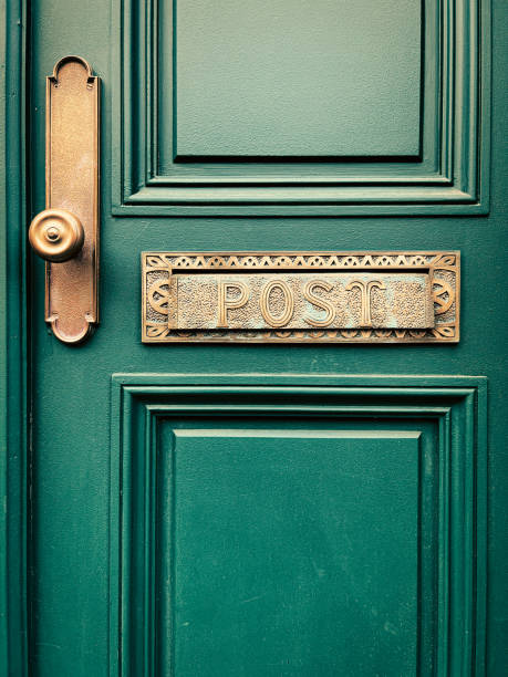 istock Dark green door with a golden handle 1452733119