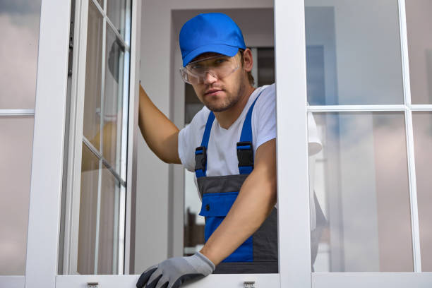 istock Serious master of maintenance plastic windows holds open window sash with hand 1452733308