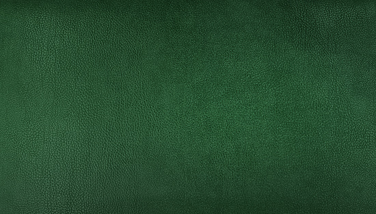 Fondo de textura de cuero genuino verde para un concepto vintage y clásico. Fondo de color esmeralda para decoraciones y texturas. color verde oscuro piel de cuero orgánico natural con patrón de líneas de diseño. photo