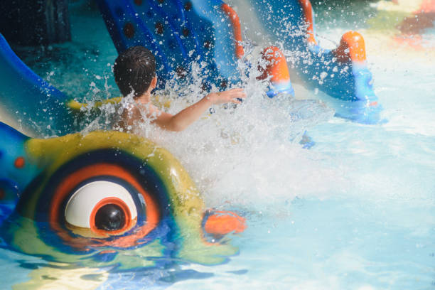 istock boy is in the water park. 1452739141