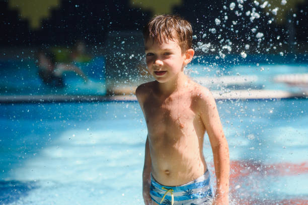 istock boy is in the water park. 1452739199